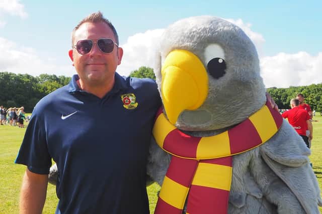 Christian Smith has been appointed as the new CEO of Northamptonshire FA. He is pictured with the county FA's new mascot