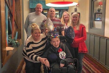 Zak with his family on his 18th birthday, three months before he died. With Zak is mum Vicki Fairhurst. Back row: Zak's uncle John, his dad, his sister Hannah and gran Elma. Image: The Fairhurst family
