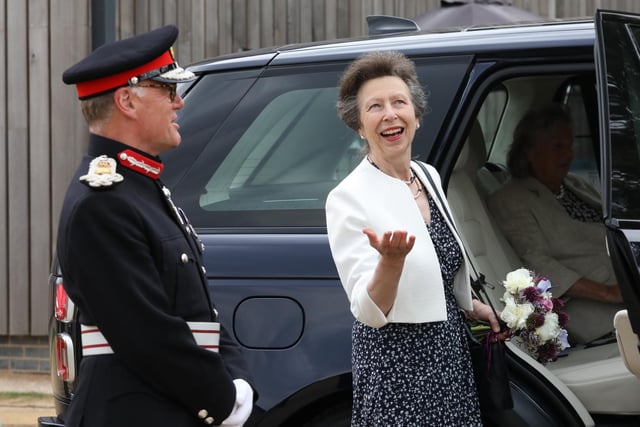 The Princess Royal welcomes the rain with Lord Lt for Northamptonshire James Saunders Watson