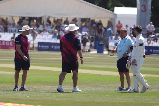 Northants head coach Darren Lehmann (centre), batting coach Greg Smith (left) and vice-captain Lewis McManus speak to match referee Mike Smith during the lunch break on day two at Canterbury (Picture: Peter Short)
