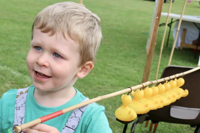 Broughton Village Show - three-year-old Seb had a splendid time on the hook-a-duck stall