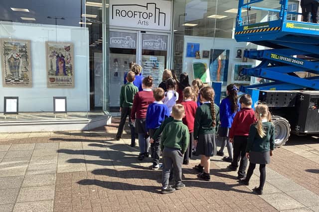 Pupils going in to view their artwork