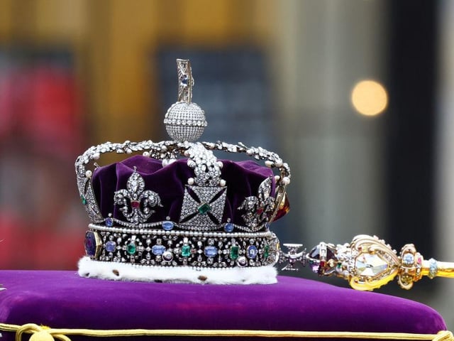 The Imperial State Crown resting on top of the coffin of Britain's Queen Elizabeth as it is carried into the Westminster Abbey during the state funeral and burial of Queen Elizabeth II