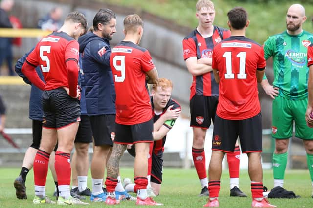 Joint boss David Bridgwater talks to the Kettering players after the draw at Hitchin (Picture: Peter Short)