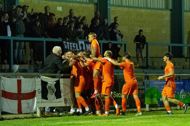 Corby Town celebrate Rory McAuley's goal in their 2-1 win at Rugby Town on Tuesday (Picture: Jim Darrah)