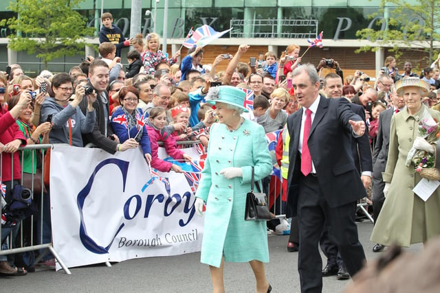The Queen accompanied by Norman Stronach Corby Council's chief executive, June 2012