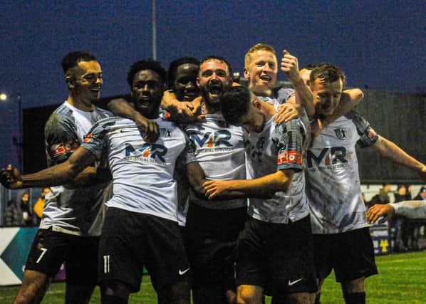 The Corby Town players celebrate their second goal in last weekend's dramatic win over Boldmere St Michaels. Picture by Jim Darrah