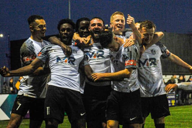 The Corby Town players celebrate their second goal in last weekend's dramatic win over Boldmere St Michaels. Picture by Jim Darrah