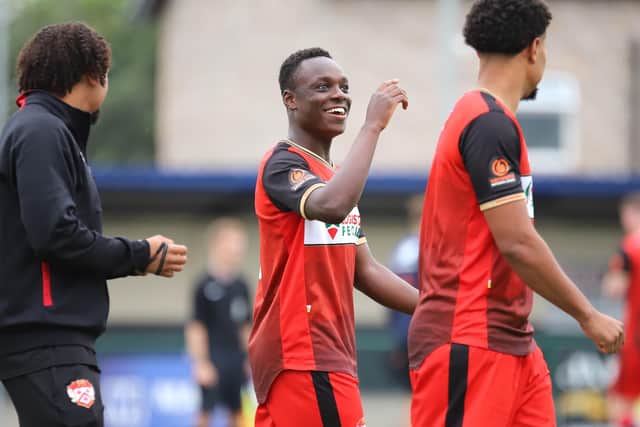 Andrew Oluwabori was all smiles after his late equaliser earned Kettering Town a 2-2 draw at Buxton last weekend. Pictures by Peter Short