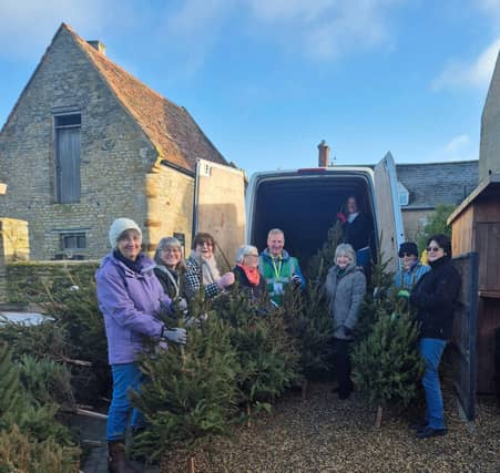 Just some of the members and volunteers who helped load the trees into the van for later chipping.