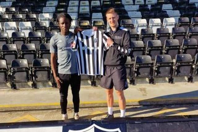 Lee Attenborough welcomes latest signing Florian Tsaguim to Steel Park. Picture courtesy of Corby Town FC