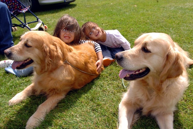 Wicksteed Park, Dog Show.  Courtney Perry, 5, and Bethany Perry, 2, with Maisie and Flint  August 2007

: