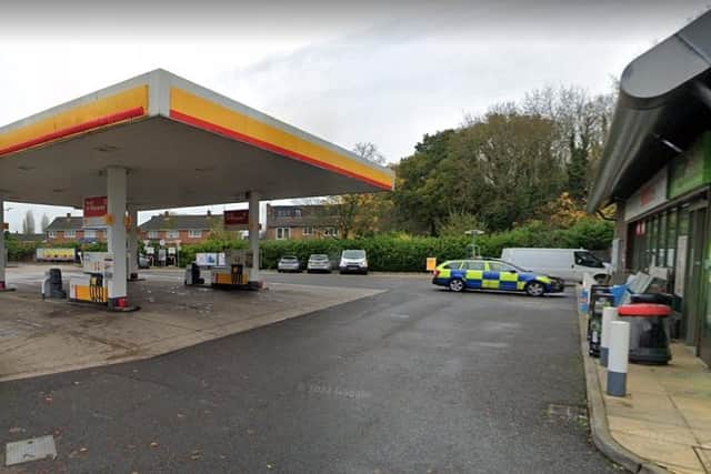 The woman was hit by Garrett's black Nissan vehicle as she left the shop at the Shell Garage in Corby. Image: NW / Google