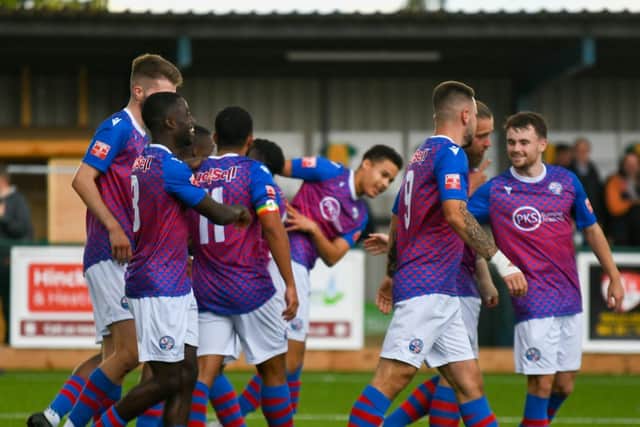 The AFC Rushden & Diamonds players celebrate one of their goals in Saturday's 2-1 success at Barwell. Picture by Hawkins Images