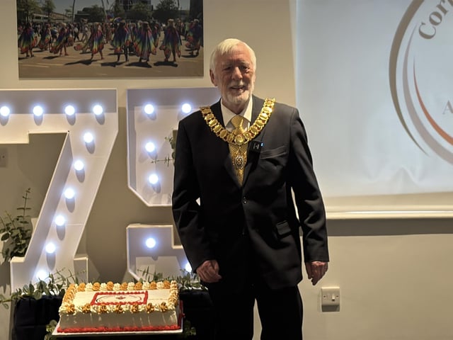 Cllr William Colquhoun attended the event and cut the cake, which guests enjoyed a slice of alongside glasses of prosecco. Corby 75th new town anniversary celebrations and launch of exhibition/National World