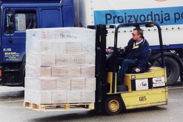 Derek moving parcels on a forklift