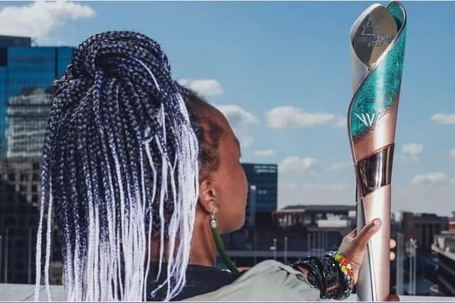Laura Nyehuye with the baton