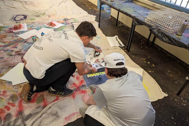Artist Dpendz delivering a schools art workshop