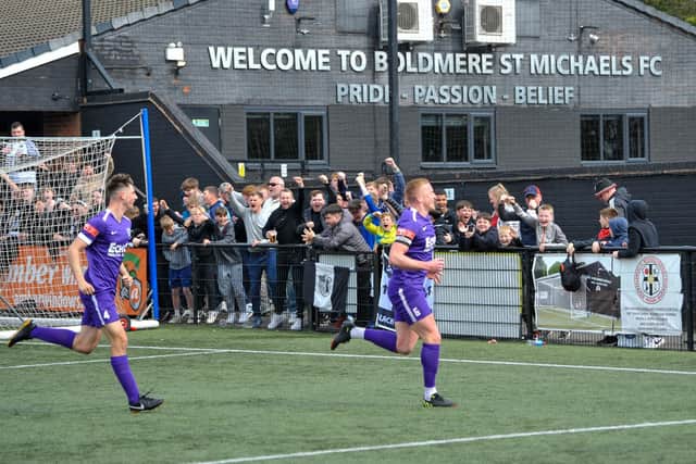 Michael Jacklin celebrates his goal in front of the delighted Corby Town fans as they won 4-0 at Boldmere St Michaels on the last day of the season. Picture by Jim Darrah