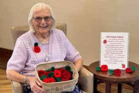 Margaret Cooper with her knitted poppies