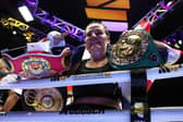 Chantelle Cameron celebrates with the title belts after victory over Mikaela Mayer in Birmingham