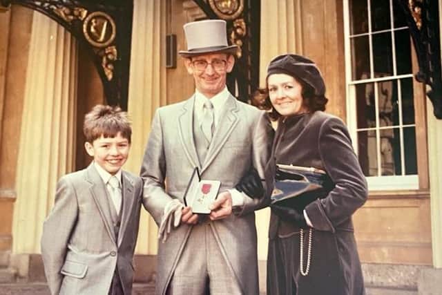 Kelvin Glendenning received his OBE accompanied by wife Irene and son Jonathan.