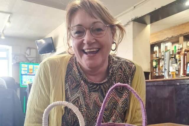 Secretary Bel loved making an Easter Basket by weaving yarn around a paper cup