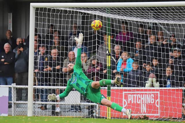 Paul White is beaten from the penalty spot (Picture: Peter Short)