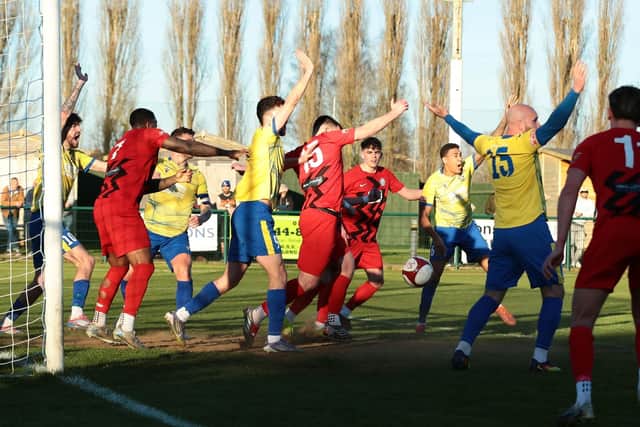 Wellingborough Town players appeal for a handball during the 0-0 draw with Long Eaton United (Picture: Rob Webb)