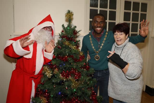Deputy mayor of Kettering Cllr Alex Evelyn with Mother Christmas Jeanette Walsh, and Santa/National World