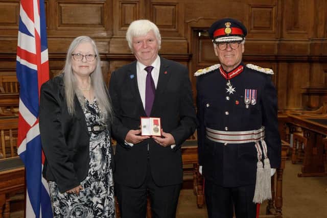 David Woods of Woodford with his BEM, his wife Hilary Jane and the Lord Lieutenant of Northamptonshire