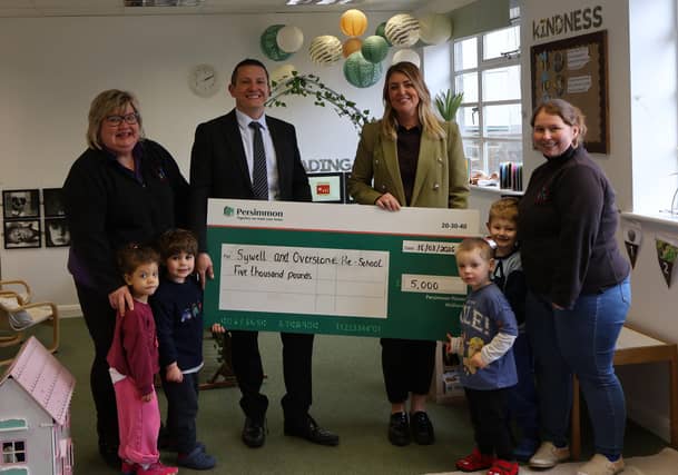 David Ablett and Claire Dearsley, Persimmon Homes (centre) with staff and children from Sywell and Overstone Pre-School