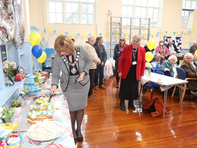 Cllr Melanie Coleman cuts the cake