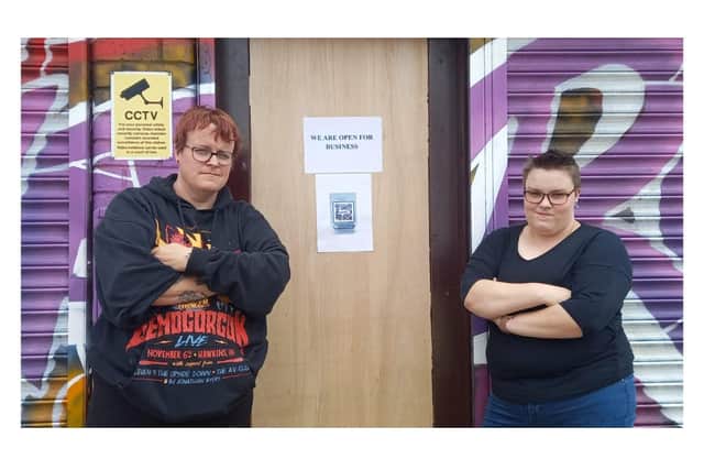 Ruth Curtis and daughter Leigha Stuart next to the damaged door