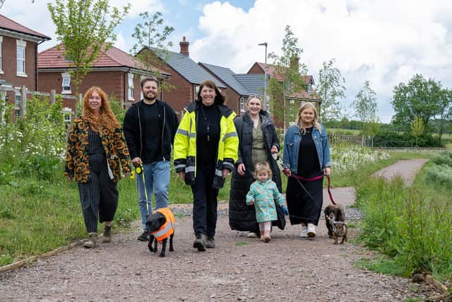 Laura Brady, Joshua Clark walking Pippy, Davidsons Homes Sales Manager Alison Ayres, Kelly Sullivan with daughter Winnie and dog Herman, and Georgia Thompson with Harper walking the Heritage Trail at Kirby Woodlands.