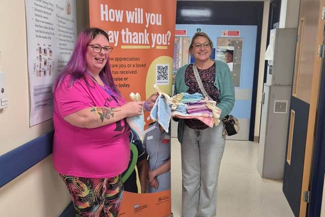 Chairperson Tammy Grigg and Secretary Bel Rose present their groups handiwork to KGH SCBU to celebrate their 2nd anniversary.