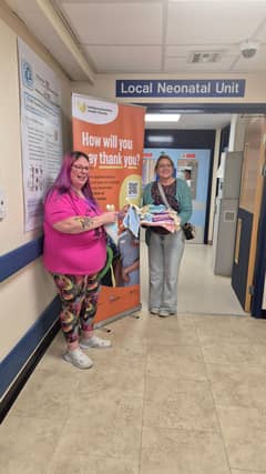 Chairperson Tammy Grigg and Secretary Bel Rose present their groups handiwork to KGH SCBU to celebrate their 2nd anniversary.