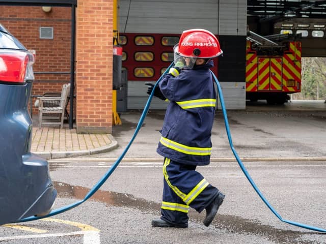 A young person taking part in a fire drill