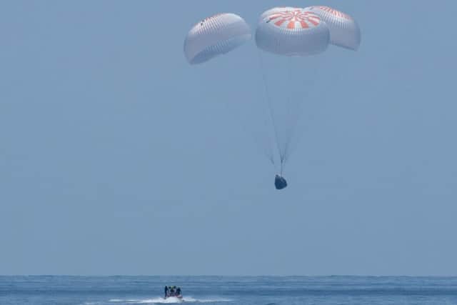 The SpaceX Crew Dragon Endeavour spacecraft as it lands with NASA astronauts Robert Behnken and Douglas Hurley onboard (Photo: NASA/Bill Ingalls)