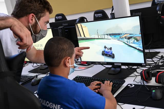 Video games could prevent later depression - but social media could lead to it (Photo by BERTRAND GUAY/AFP via Getty Images)