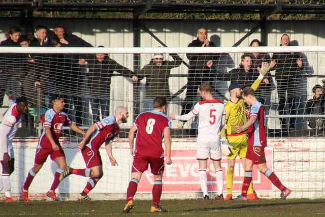 Chesham celebrate their opening goal as the inquest starts in the Poppies defence