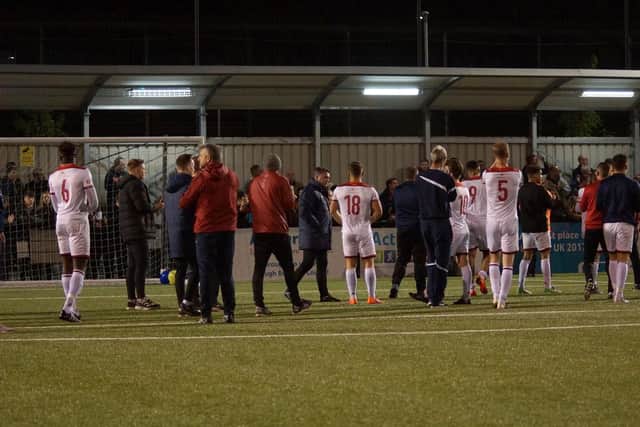 The Kettering Town players applaud their supporters following the play-off semi-final defeat at Slough Town. Pictures by Peter Short