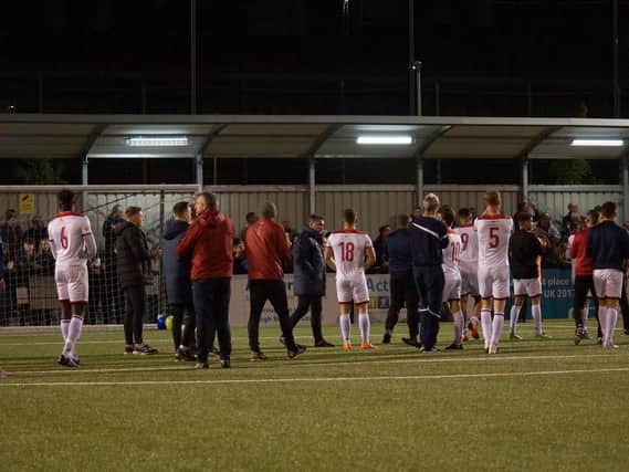 The Kettering Town players applaud their supporters following the play-off semi-final defeat at Slough Town. Pictures by Peter Short