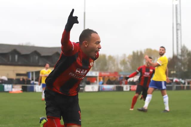 Rhys Hoenes celebrates after he headed home the Poppies' second goal