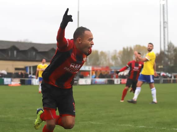 Rhys Hoenes celebrates after he headed home the Poppies' second goal