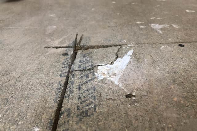 Areas of the floor under carpets and vinyl were cracked