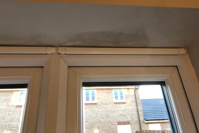 This area above a window was water damaged
