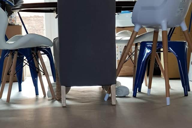 This was the view of the floor under one table, which was clearly not even