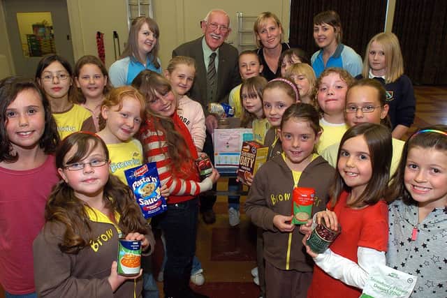 The 9th Corby Brownies donated a box of food to Lakelands for Harvest Festival in 2007