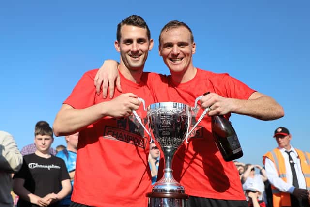 Kettering Town's players enjoy their title party